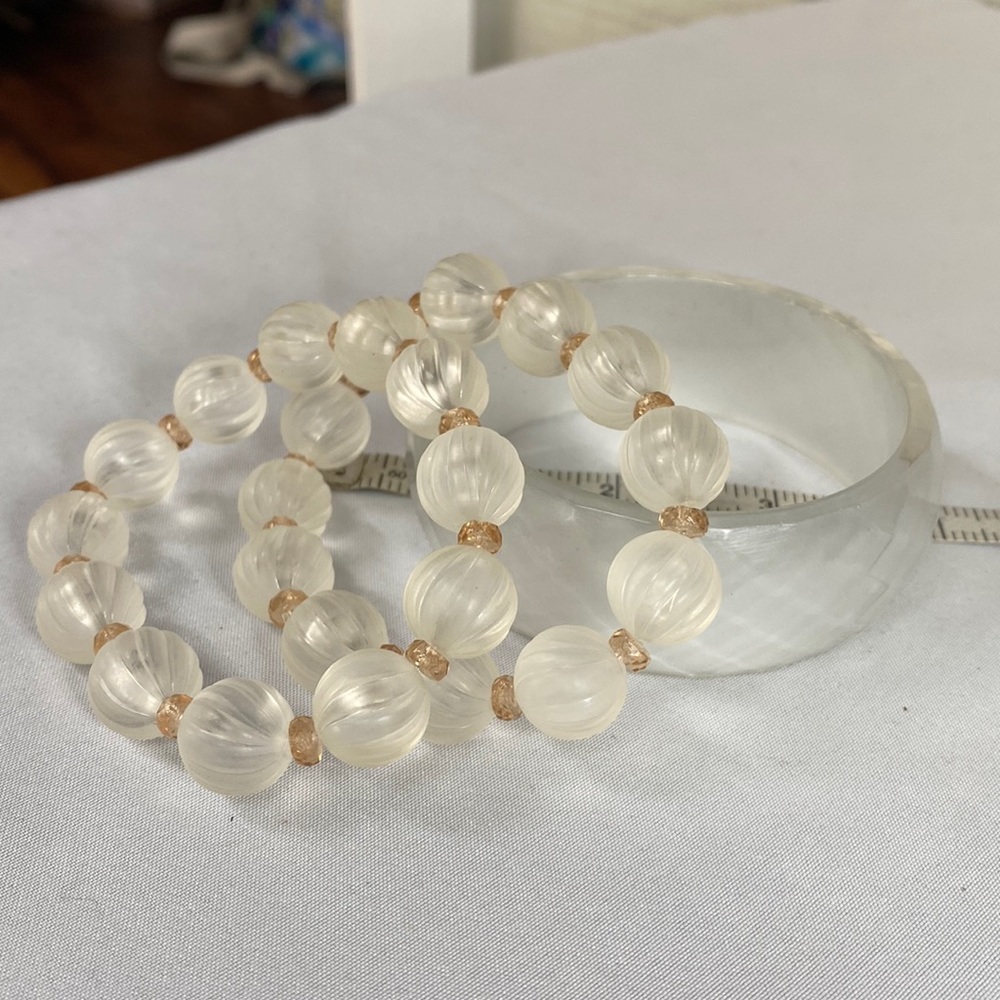 Group of three clear frosted bracelets